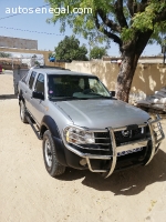 Véhicule Nissan 4x4 double cabine à louer